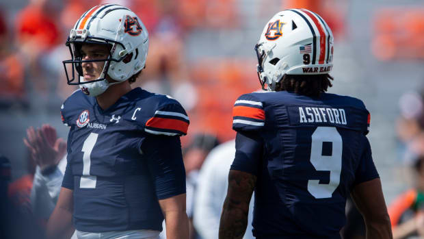 Auburn quarterbacks Patyton Thorne (No. 1) and Robby Ashford (No. 9) warm up during pregame prior to their Week 5 matchup against No. 1 Georgia at Jordan-Hare Stadium. 